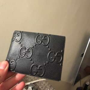 Portefeuille noir motif GG